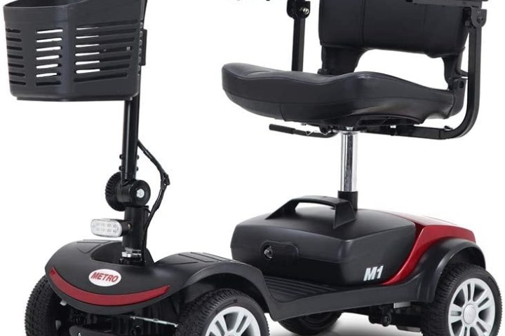 Red and black mobility scooter with a front basket and four wheels.
